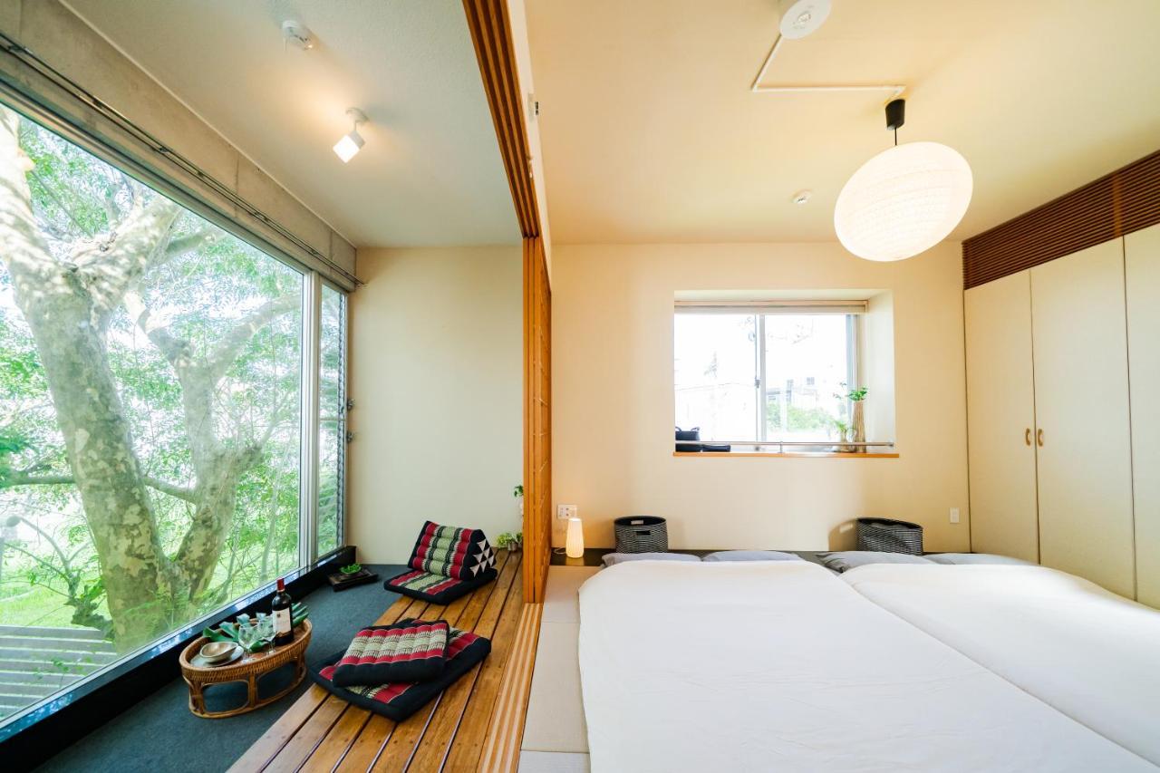 Em Tree House Villa Uruma Exterior photo